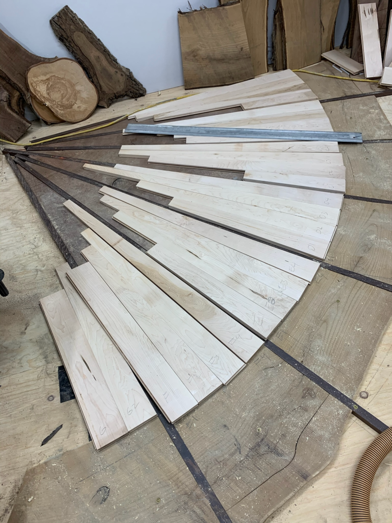 Building a custom hardwood floor called Seattle Swoosh