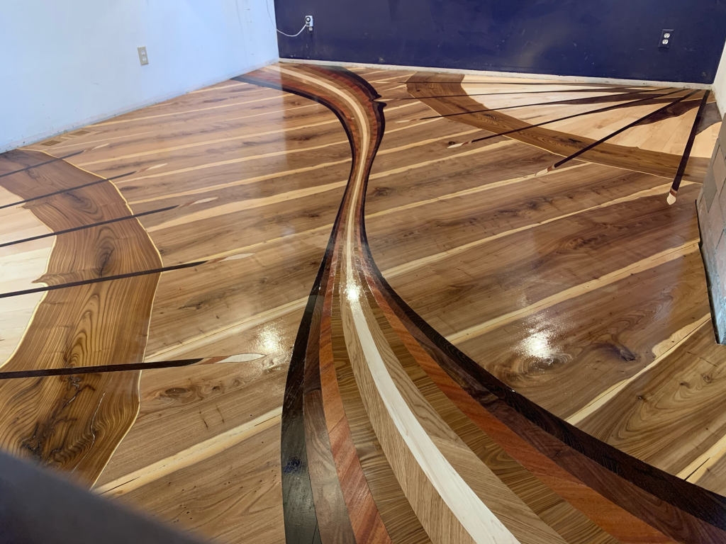 Custom hardwood art floor final image of Seattle Swoosh