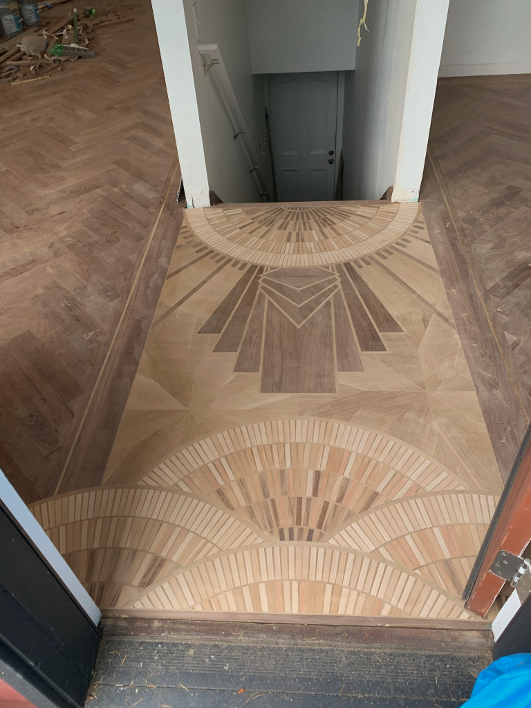 A picture of a custom hardwood art floor in the Art Deco style. 