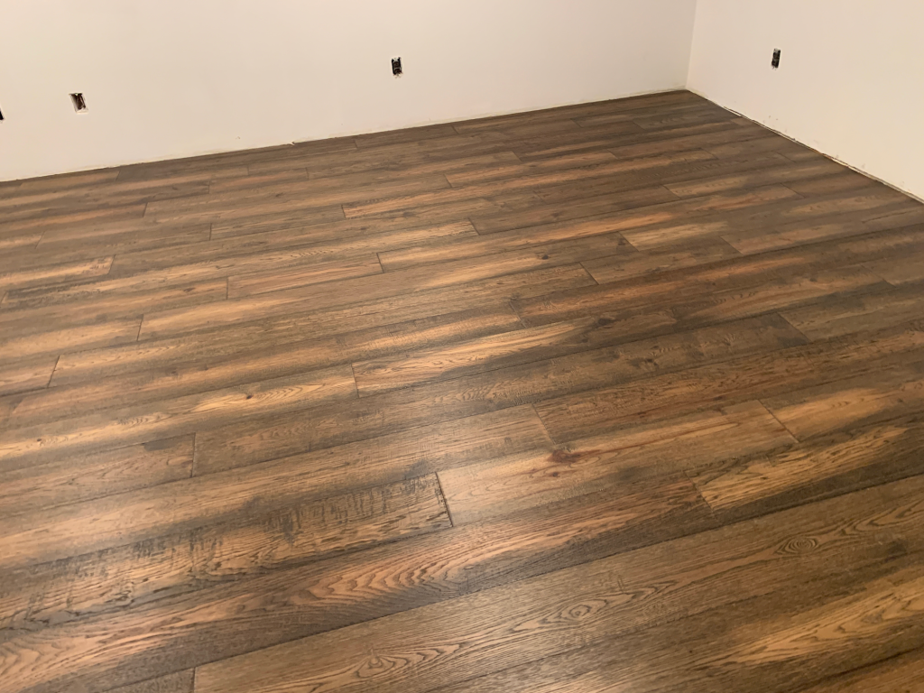 A picture of engineered hardwood flooring installed in a basement.